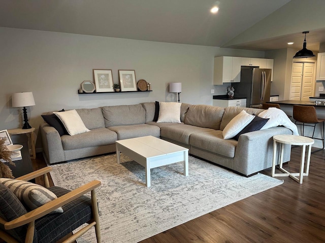 1817 Ridgewood Cir, Menomonie, WI 54751 - living area with dark wood-type flooring, lofted ceiling, and recessed lighting