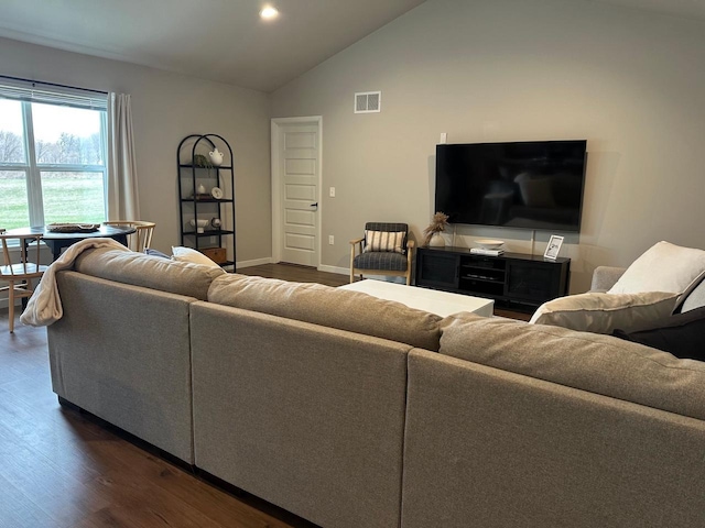 1817 Ridgewood Cir, Menomonie, WI 54751 - living room with dark wood-style floors, vaulted ceiling, and baseboards
