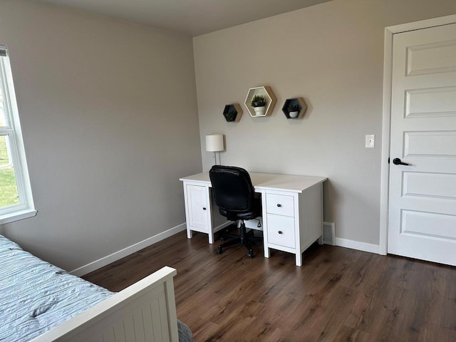 1817 Ridgewood Cir, Menomonie, WI 54751 - bedroom featuring baseboards, dark wood finished floors, and a desk