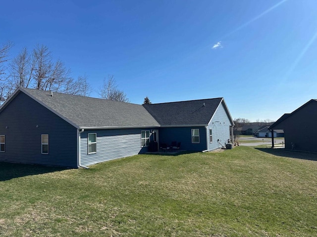 1817 Ridgewood Cir, Menomonie, WI 54751 - rear view of property featuring a lawn and roof with shingles