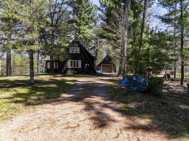 101224 25th St, Chetek, WI 54728 - a-frame home with dirt driveway and an outdoor structure