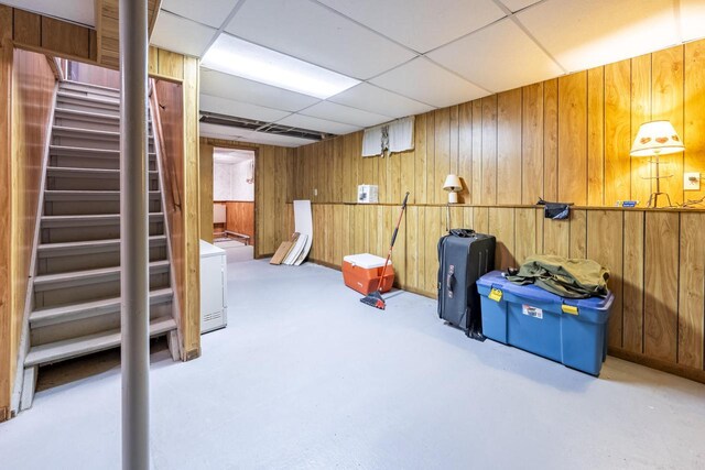 101224 25th St, Chetek, WI 54728 - finished basement with wooden walls, stairs, and a paneled ceiling