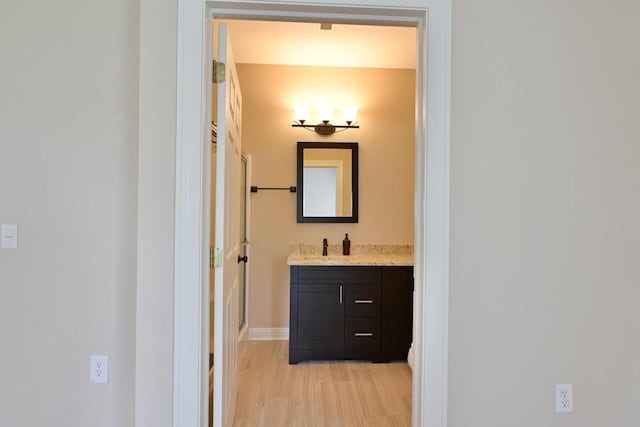 bathroom with vanity and baseboards