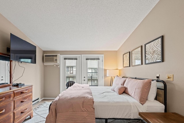 bedroom featuring baseboard heating, a textured ceiling, french doors, a wall unit AC, and vaulted ceiling