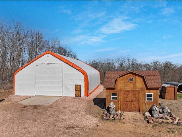 garage featuring a shed
