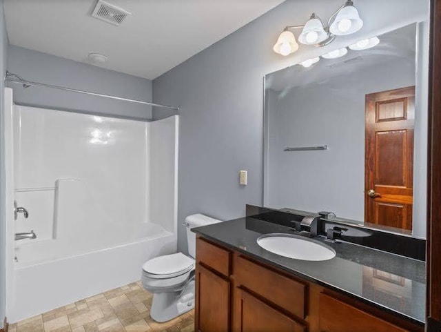 bathroom with visible vents, shower / bathing tub combination, toilet, and vanity
