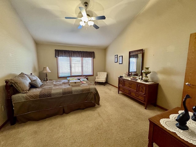 3027 S Bartells Dr, Beloit, WI 53511 - bedroom featuring a ceiling fan, baseboards, vaulted ceiling, and light carpet