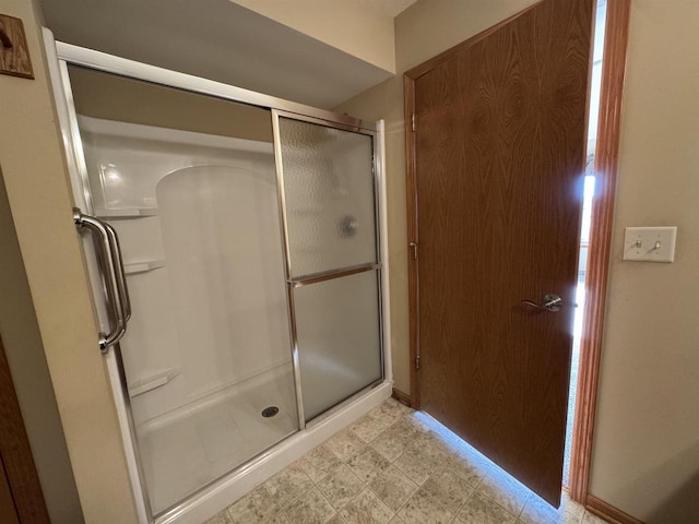 3027 S Bartells Dr, Beloit, WI 53511 - bathroom featuring a stall shower and tile patterned floors