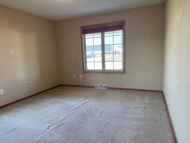 3027 S Bartells Dr, Beloit, WI 53511 - carpeted spare room featuring baseboards