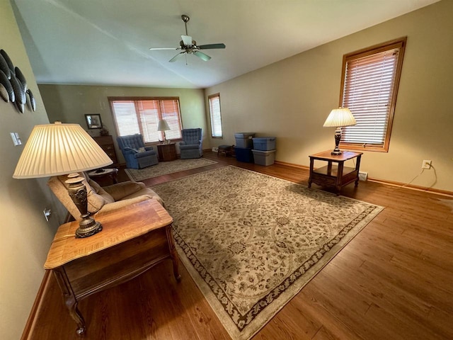 3027 S Bartells Dr, Beloit, WI 53511 - living area featuring baseboards, ceiling fan, wood finished floors, and lofted ceiling