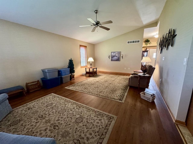 3027 S Bartells Dr, Beloit, WI 53511 - living area with plenty of natural light, a ceiling fan, wood finished floors, and lofted ceiling