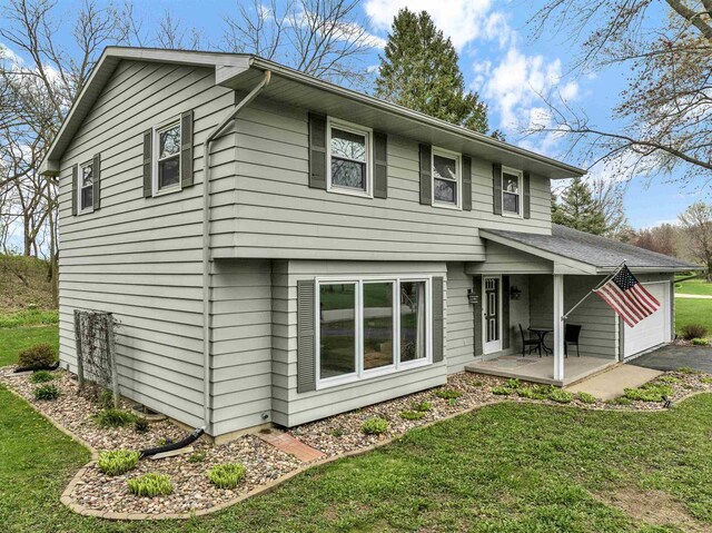 6643 Forest Park Dr, Deforest, WI 53532 - back of house with a lawn and a patio area