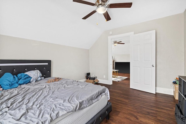 bedroom with a ceiling fan, baseboards, wood finished floors, and lofted ceiling