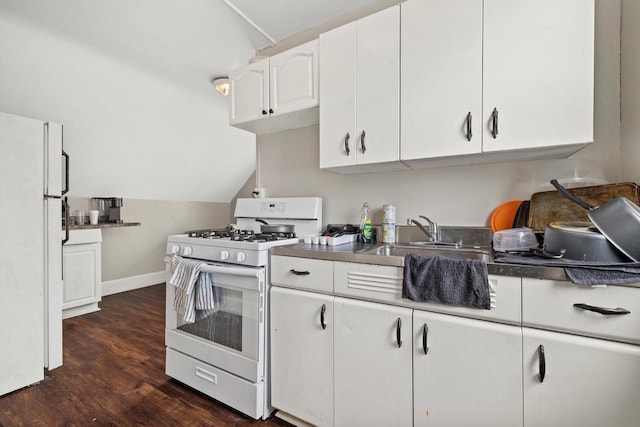 kitchen featuring a sink, white appliances, white cabinetry, lofted ceiling, and dark wood-type flooring