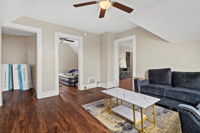 living room with baseboards, a ceiling fan, and wood finished floors