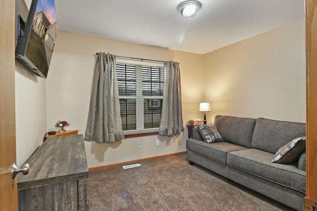 living room featuring visible vents, carpet flooring, and baseboards