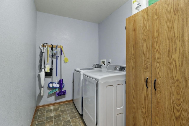 laundry room featuring laundry area, washing machine and dryer, and baseboards