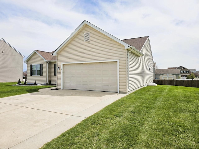 view of front of house featuring fence, driveway, a front yard, and a garage