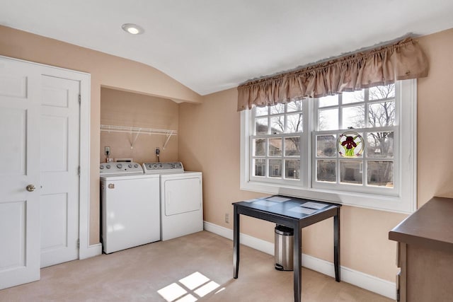 clothes washing area featuring separate washer and dryer, laundry area, baseboards, and light colored carpet
