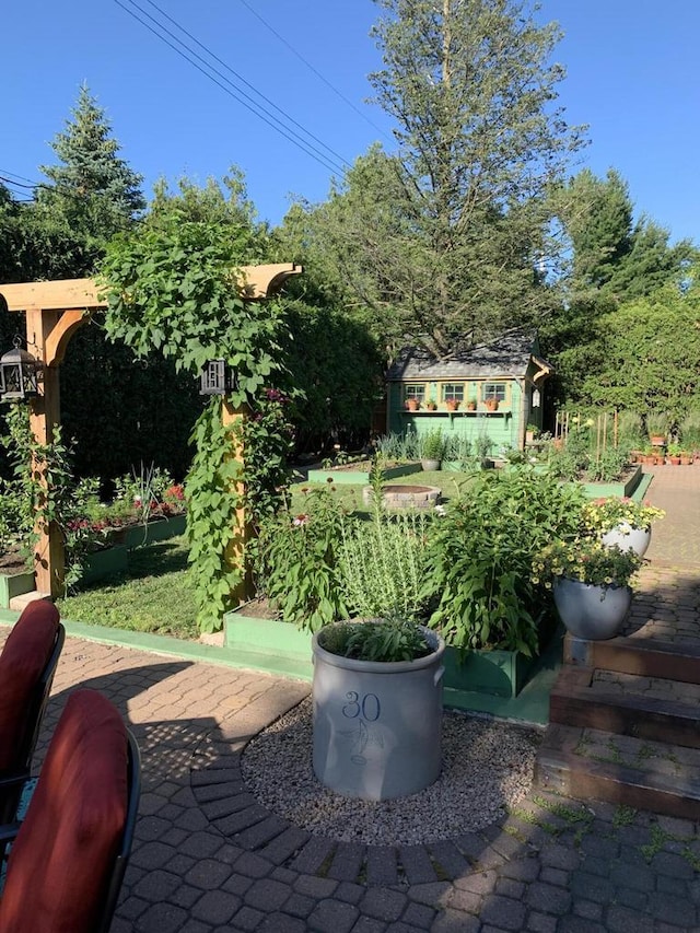 view of patio / terrace with an outbuilding