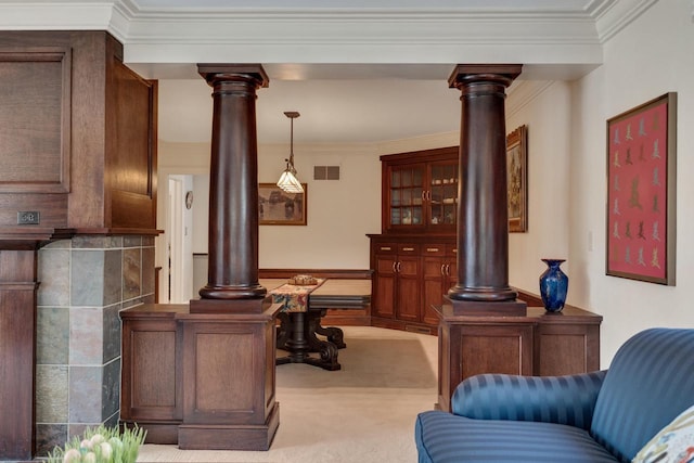 interior space with ornamental molding, carpet, visible vents, and ornate columns