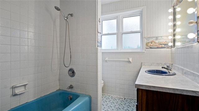 1413 E Clairemont Ave, Eau Claire, WI 54701 - full bath with tile walls, vanity, and shower / washtub combination