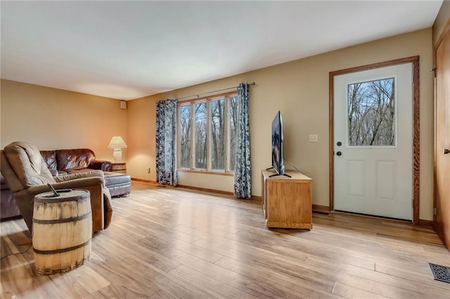 E5081 865th St, Boyceville, WI 54725 - living area with light wood-style floors, visible vents, and plenty of natural light
