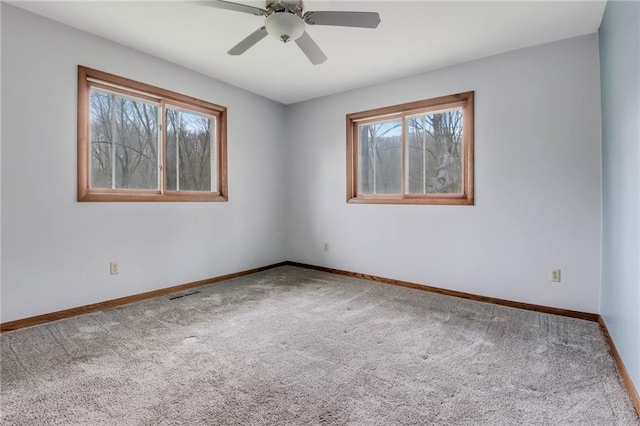 E5081 865th St, Boyceville, WI 54725 - carpeted spare room featuring ceiling fan, baseboards, and a healthy amount of sunlight