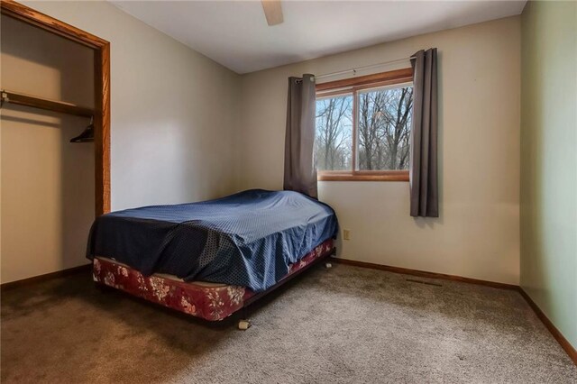 E5081 865th St, Boyceville, WI 54725 - bedroom with ceiling fan, carpet, and baseboards