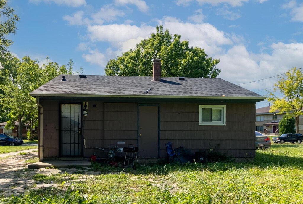 5724 N 62nd St, Milwaukee, WI 53218 - back of property featuring a chimney and roof with shingles