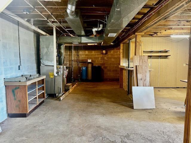 unfinished basement with heating unit