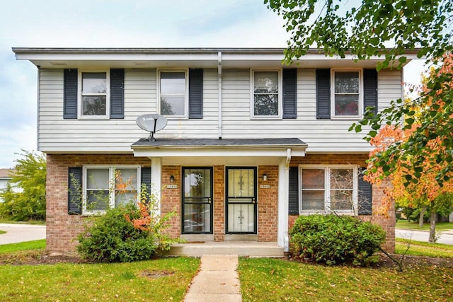 view of front of property featuring a porch and brick siding