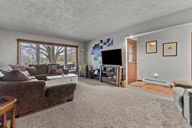 carpeted living room with a textured ceiling, baseboards, and a baseboard radiator