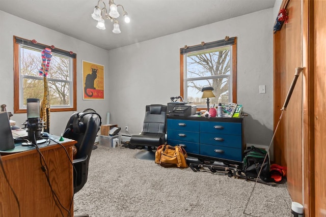 office space with a chandelier and carpet floors