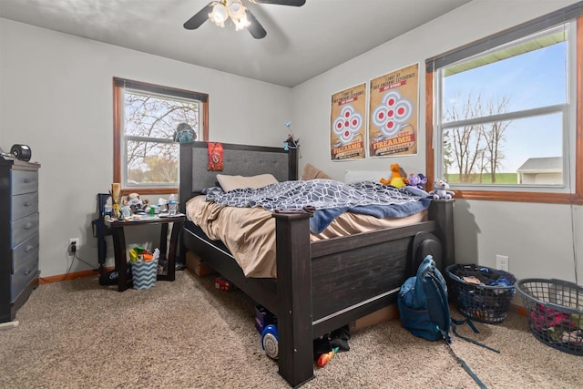 bedroom featuring carpet flooring, baseboards, and ceiling fan