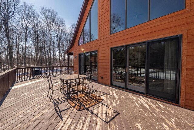 9327 Strong Rd, Argonne, WI 54511 - wooden terrace with outdoor dining space