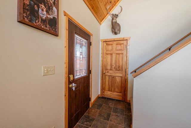 9327 Strong Rd, Argonne, WI 54511 - entryway featuring baseboards, stone finish floor, wood ceiling, and vaulted ceiling