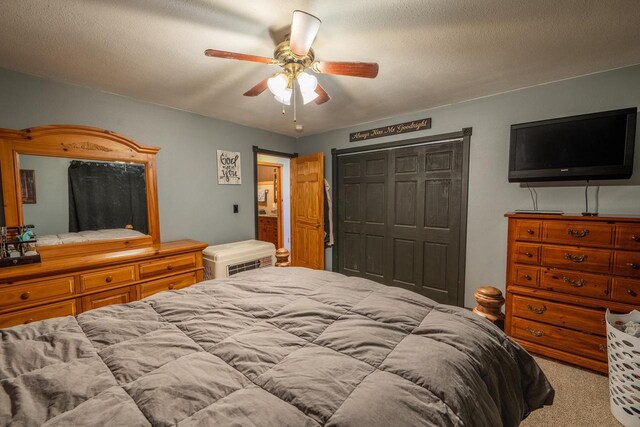 9327 Strong Rd, Argonne, WI 54511 - carpeted bedroom with a textured ceiling, a closet, and a ceiling fan