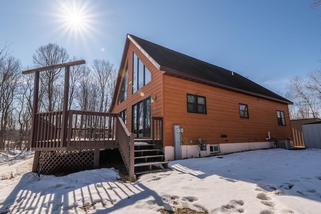 9327 Strong Rd, Argonne, WI 54511 - snow covered property with central air condition unit and a deck