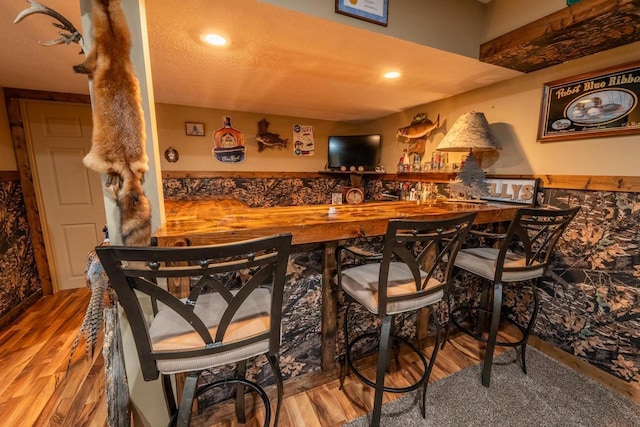 9327 Strong Rd, Argonne, WI 54511 - bar featuring wood finished floors, indoor wet bar, and recessed lighting