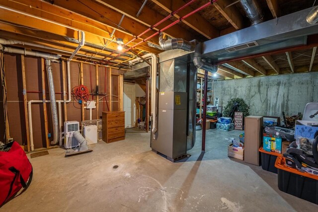 9327 Strong Rd, Argonne, WI 54511 - unfinished below grade area featuring heating unit and visible vents