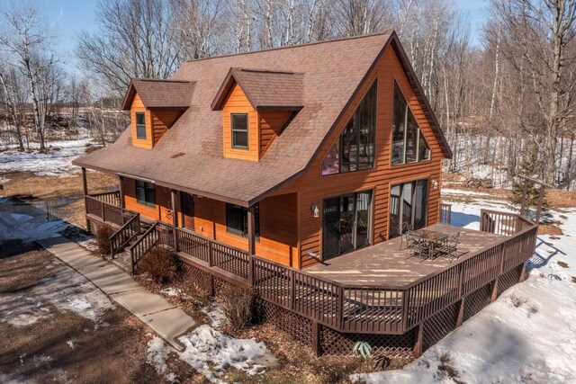 9327 Strong Rd, Argonne, WI 54511 - snow covered house with roof with shingles and outdoor dining space