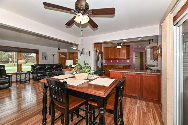dining area featuring wood finished floors and a ceiling fan