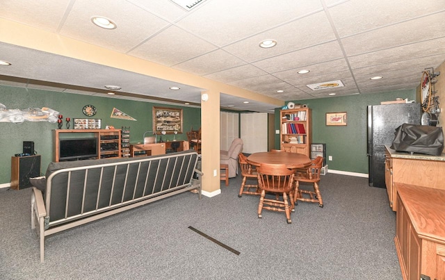 carpeted dining space with a paneled ceiling, baseboards, and recessed lighting