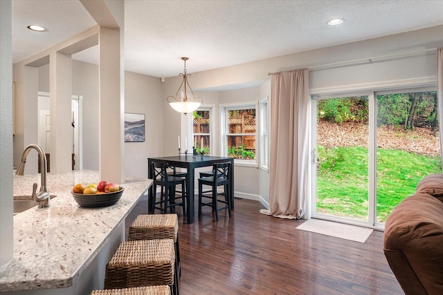 1218 Red Cedar Ct, Onalaska, WI 54650 - dining area with recessed lighting, a textured ceiling, and dark wood-type flooring