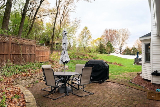 1218 Red Cedar Ct, Onalaska, WI 54650 - view of patio featuring outdoor dining area, fence, and grilling area