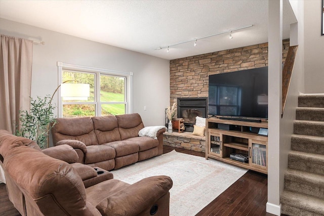 1218 Red Cedar Ct, Onalaska, WI 54650 - living room with stairs, hardwood / wood-style floors, a fireplace, and track lighting