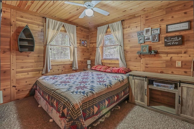 7589 Nose Lake Rd, Rhinelander, WI 54501 - carpeted bedroom featuring multiple windows, wood walls, and wood ceiling