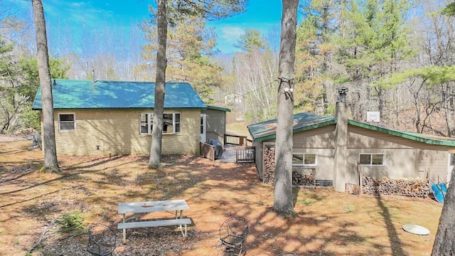 7589 Nose Lake Rd, Rhinelander, WI 54501 - rear view of property featuring a chimney