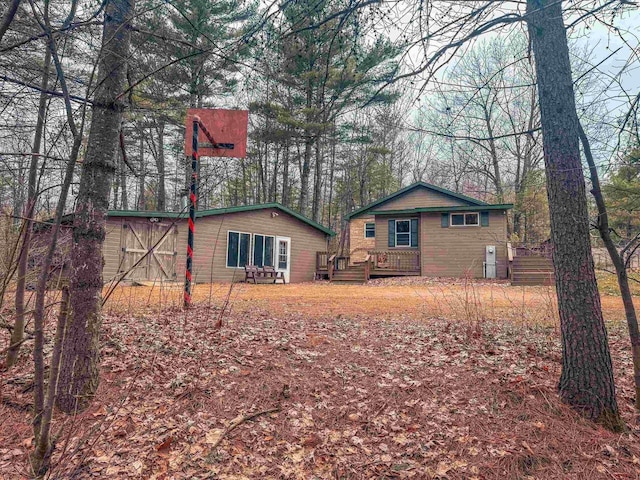 7589 Nose Lake Rd, Rhinelander, WI 54501 - rear view of house featuring a wooden deck